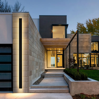 Modern house exterior with illuminated steps and facade