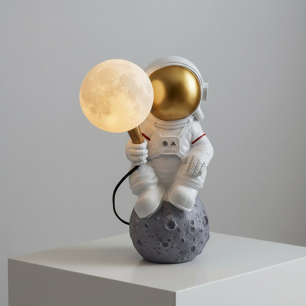 Decorative lamp shaped like an astronaut holding a moon and sun on a shelf.