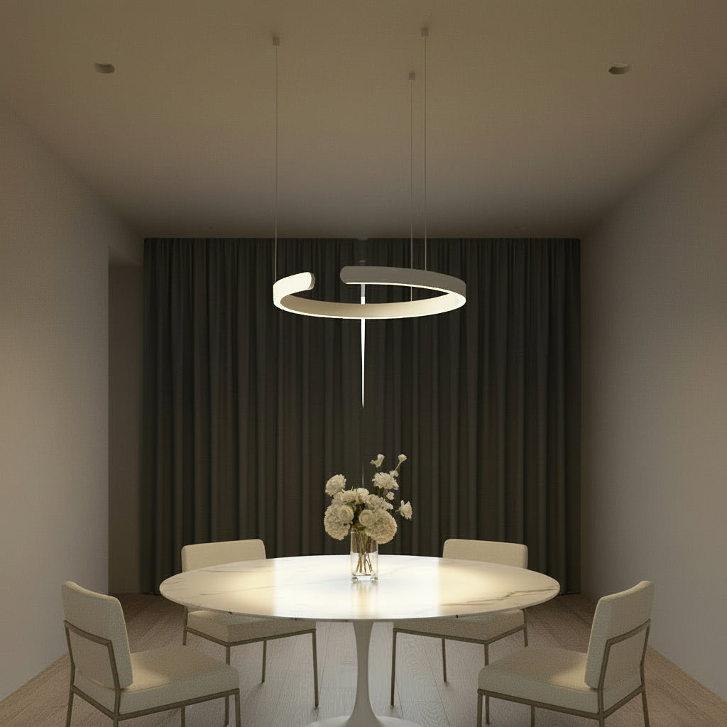 Modern pendant light hanging above a table with a vase of flowers in a room with decorative walls.