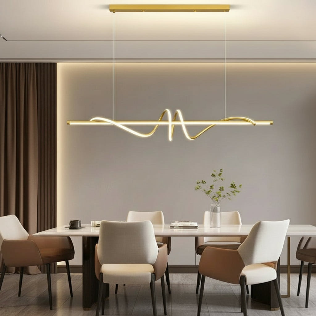 Modern dining room with gold pendant lights and 'Kagu' branding.