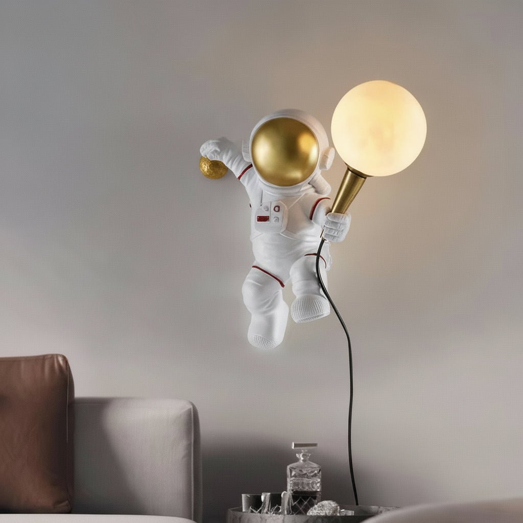 Spaceman-themed lamp with gold and white lights in a room setting.