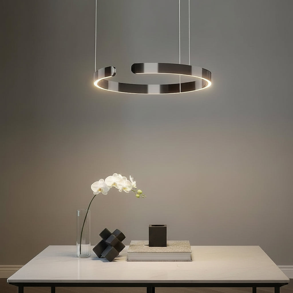 Modern pendant light fixture in a room with decorative elements.