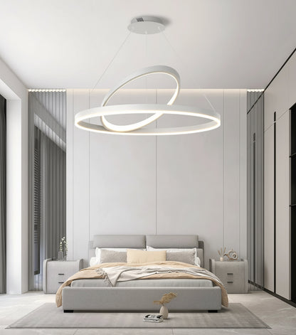 Modern bedroom with a bed, nightstands, and a stylish ceiling light fixture.