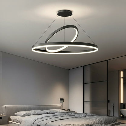 Modern pendant light fixture in a bedroom setting with KAGU branding.