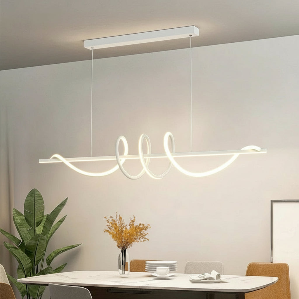 Modern pendant light fixture in a dining room setting with Kagu branding.